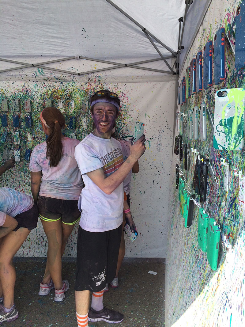 Color runners choosing freshly splatter-painted Speck CandyShell cases. I think he found one!