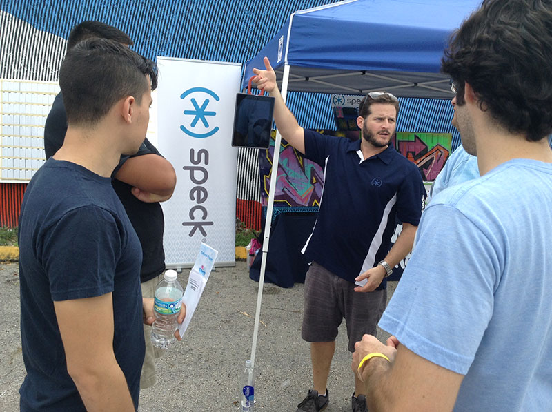 Speck at Miami Mini Maker Faire - Ramon demonstrating the sturdiness of our HandyShell